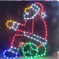 Prelit LED Santa Sitting on a log